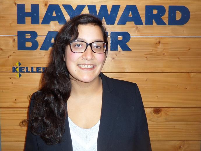 female employee smiling at camera headshot