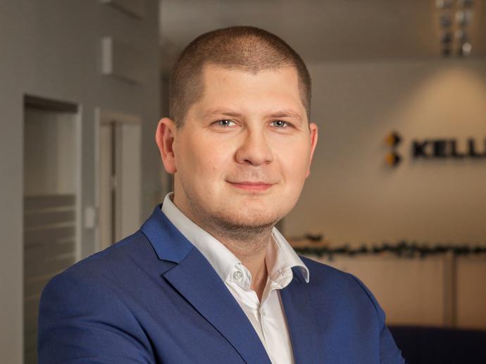 male employee in shirt and blazer headshot