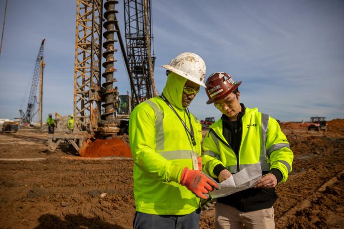 Two Keller employees on site discussing