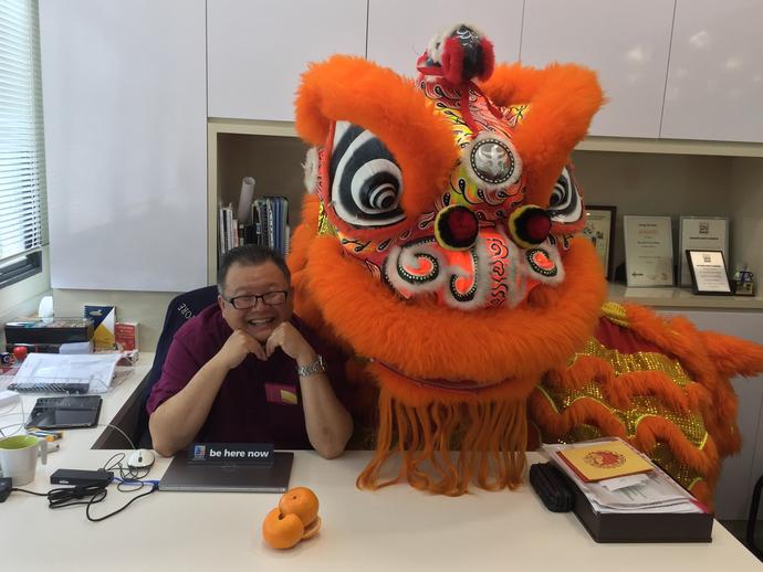 Keller employee with dragon celebrating Lunar New Year