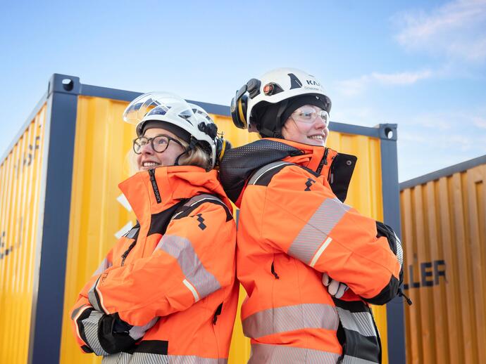 Two female Keller employees wearing personal protective equipment