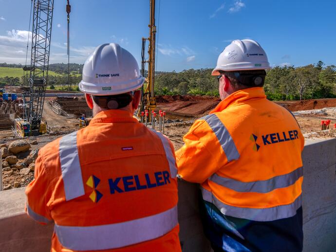 Two male employees look over site in Keller Australia