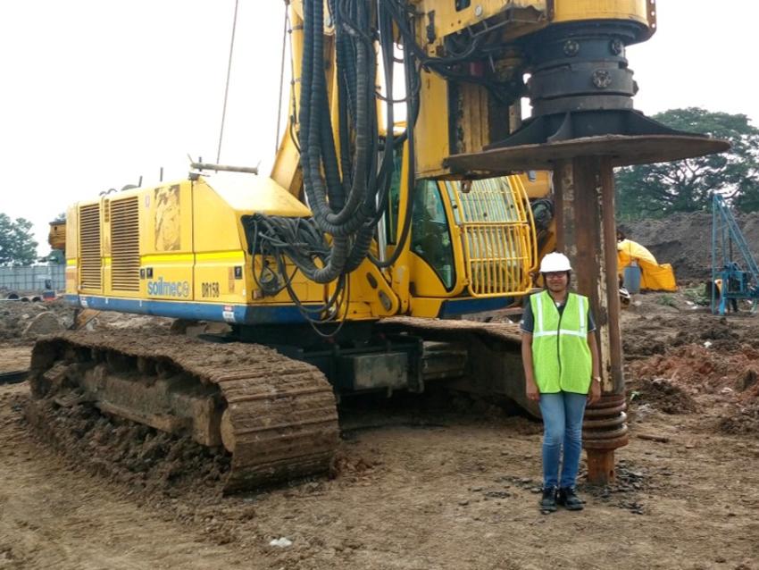 female keller engineer stood in front of rig