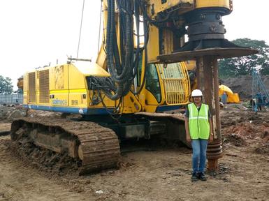 female keller engineer stood in front of rig