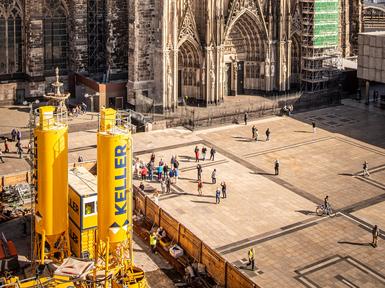 yellow keller branded tanks in front of cathedral