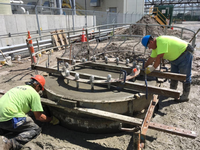 two workers on site wearing ppe