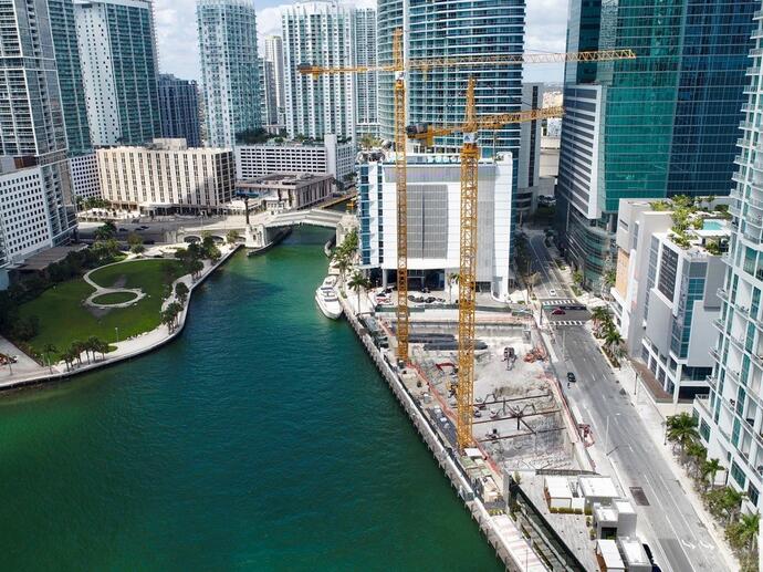 river running through skyscraper buildings
