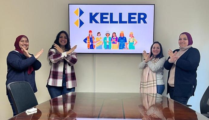Four Keller employees doing the break the bias pose