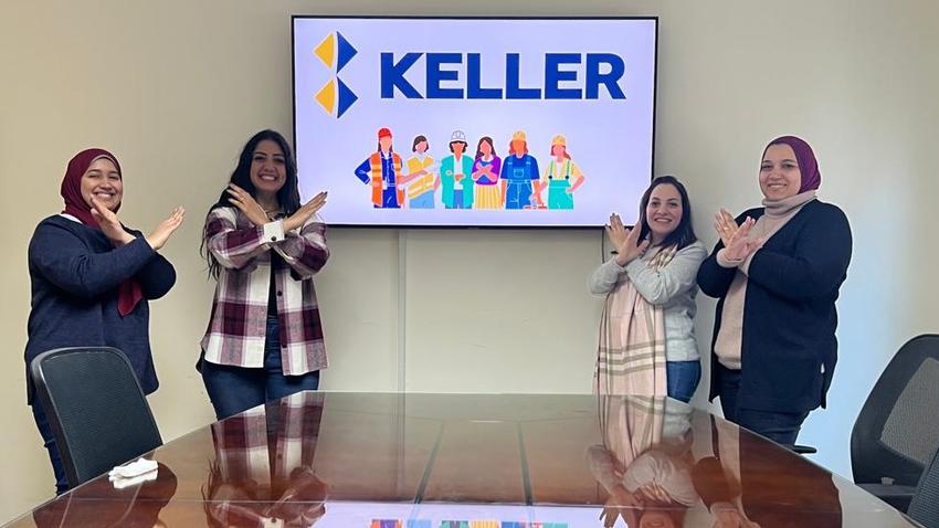 Four Keller employees doing the break the bias pose